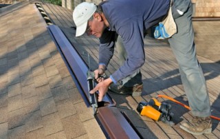 man caulking ridge vent