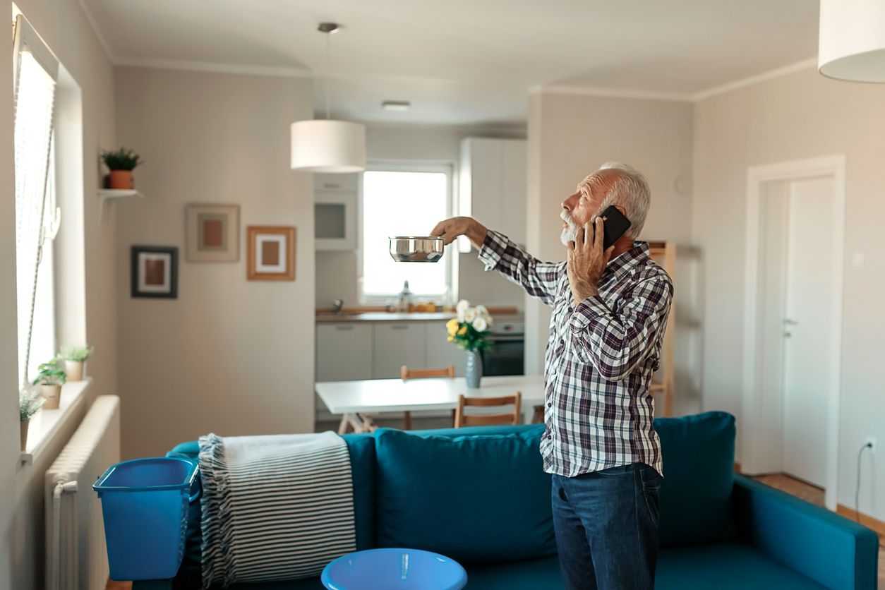 man calling landlord for roofing problems