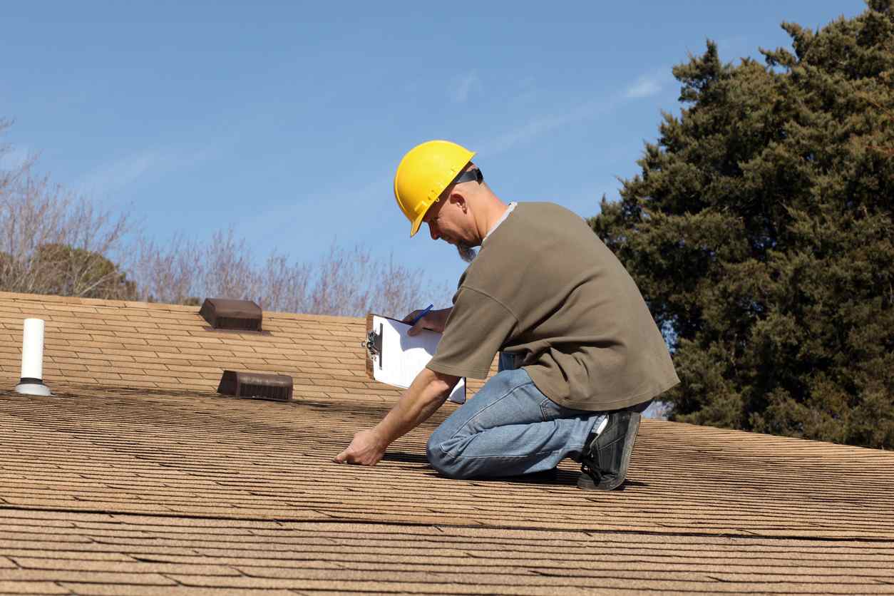 roof inspector checking for leaks