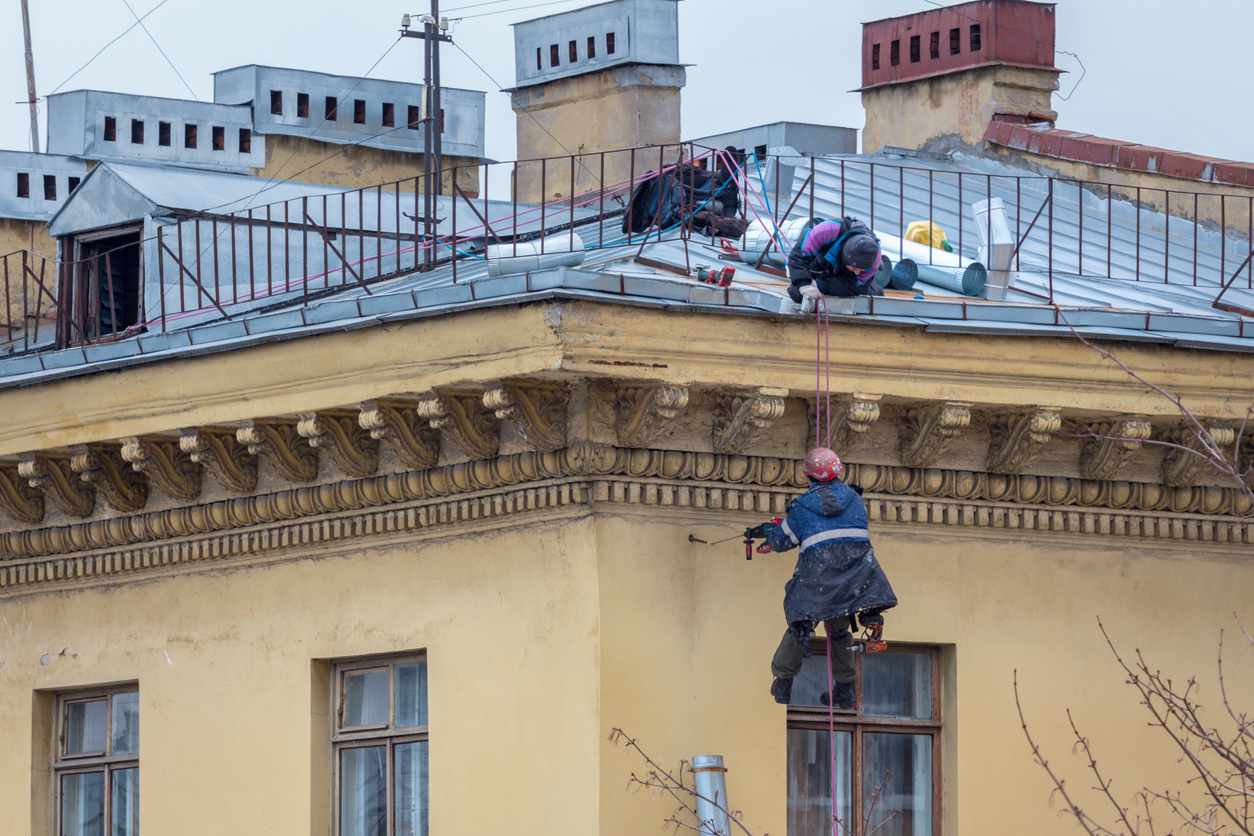 workers repairing a roof