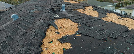 Storm-damaged shingle roof